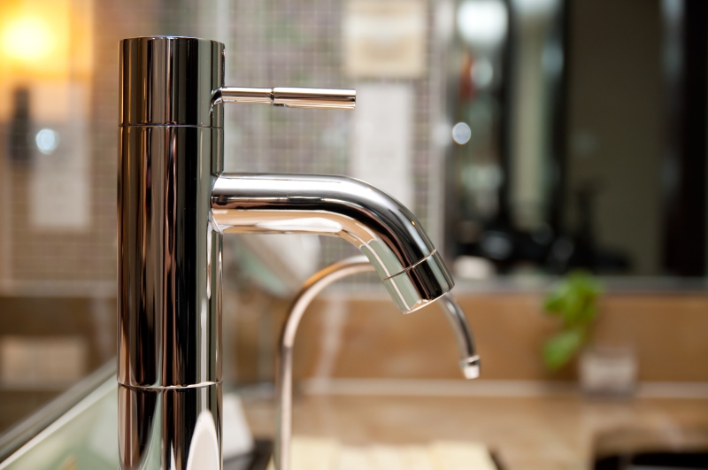 Leaking tap being repaired in Chingford